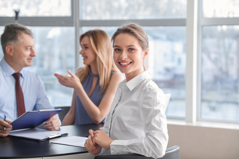 Female employee presenting a business case to senior management.