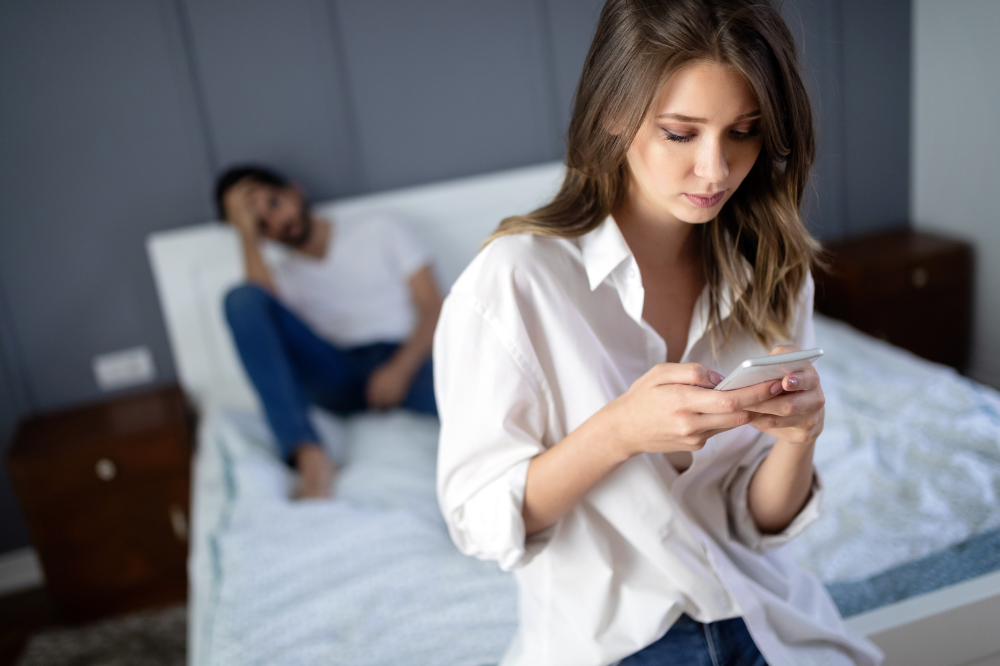 Woman at home on the phone in her personal time.