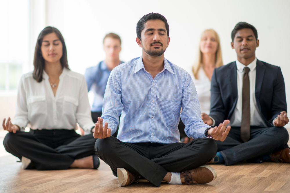 Employees practicing meditation.